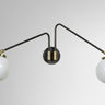 Array wall light in bronze with opal glass globes, studio view. The twin version is shown