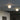 Two Mezzo opal globes mounted on the ceiling beside a mirrored wall