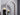 Lucid table lamp with a honed alabaster dome on a brass base, in a room setting