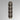 Tall Ring wall light in bronze with stacked metal rings, studio view