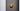 Pendulum wall light with a satin brass disc on a dark wall