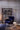 Heron floor lamp beside a chair in a room