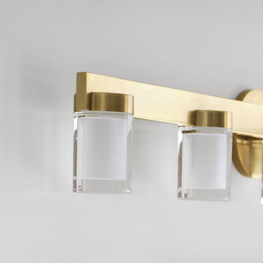 Natural Brass finish linear 5-light LED bathroom wall sconce. 
