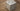 Stainless steel AMS cube lamp with a cut-out pattern on a wooden surface