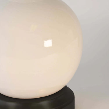 Wireless ceramic table lamp in ivory finish with tapered linen shade