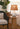 Cordless ceramic lamp providing warm ambient light in living room