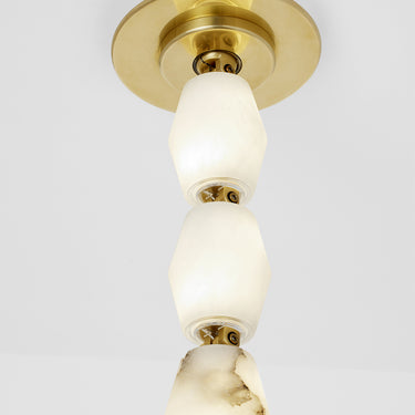 Collier 28 Alabaster sconce, showing natural brass patina finish, details.