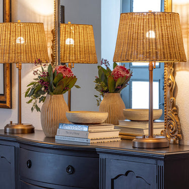 Alexis Cordless Table Lamp providing soft lighting with rattan shade