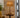 Alexis Cordless Table Lamp, a modern lantern with brass and rattan accents