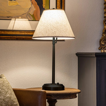 Decorative cordless table lamp with linen shade for reading corner or bedside use