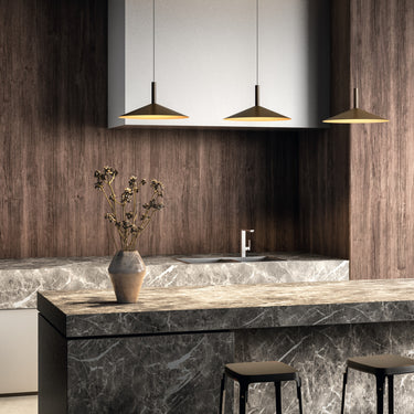 Penta Altura pendant light with a conical shade, hung over a table