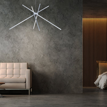 ET2 Alumilux Aster starburst of slim aluminum bars on a textured gray wall beside a cream leather sofa