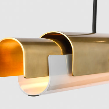 Contemporary Ambrose 54-inch LED fixture above a kitchen island in a residential setting.