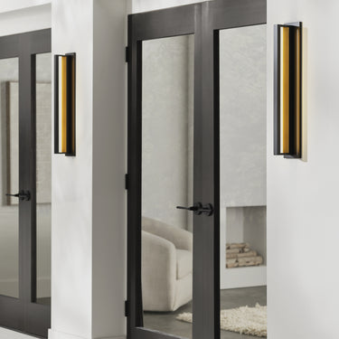Anton Large brass-blade outdoor sconce on a designer exterior