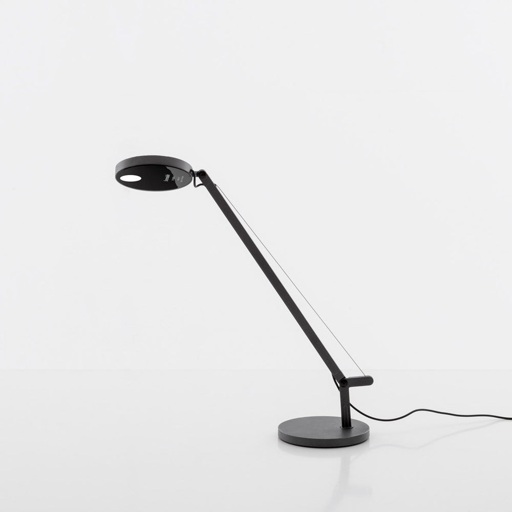 Artemide Demetra Focus Lamp Illuminating a Home Office Desk