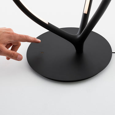 Close-up of Arrival Table Lamp's Unique Three-Arm Design