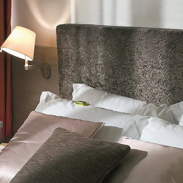 Modern adjustable wall light for bedside and hotel room lighting