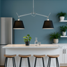 Artemide Tolomeo Double Black adjustable pendant light over modern kitchen island with 4 stools
