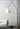 Modern adjustable LED floor lamp with parchment shade for residential living rooms and commercial office spaces