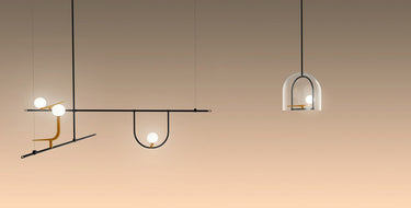 Energy-efficient Artemide Yanzi LED pendant lamp with brass bird accents and opal glass globes