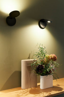 Sleek Italian Demetra LED wall spot by Artemide, ideal for residential reading nooks and offices