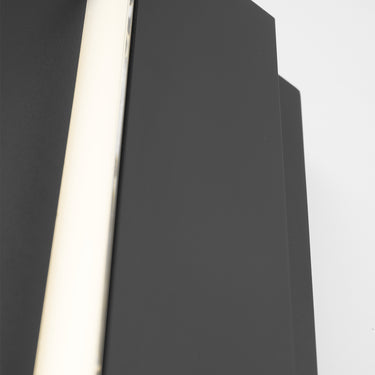 Aspen 26" contemporary outdoor wall light illuminating a porch at night.