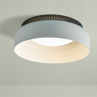 Wide white Aspen C ceiling lamp against a sage green wall