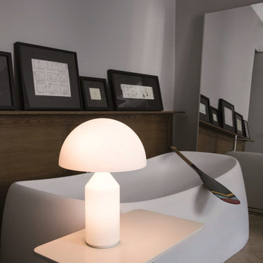 Dimmable LED Atollo Opal table lamp by Oluce for modern office desk lighting