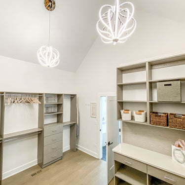 ET2 Aura pendants over a dressing room with open shelving and cabinetry