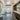 ET2 Aura pendant above a bathroom vanity with a large mirror and soaking tub in view