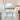 ET2 Aura pendant lit over a freestanding tub in a bathroom with a tall window