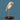 Almond Beige Bird lamp by Daqiconcept in profile on blue