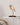 Almond Beige Bird lamp by Daqiconcept on a slim side table