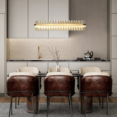 Adjustable crystal brass pendant light over table