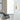 Visual Comfort Modern Banda 13" Wall Light, Brass  Finish, Side View in Office Lobby