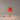 Elegant Basica M1 bedside table lamp by Santa & Cole with soft ambient illumination, Red-Amber Ribbon Shade