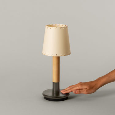 Santa and Cole portable table lamp with beige parchment shade and natural birch wood finish