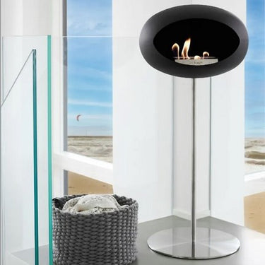 Close-up of Dome Black Ground Steel High Fireplace by Le Feu with bioethanol flame