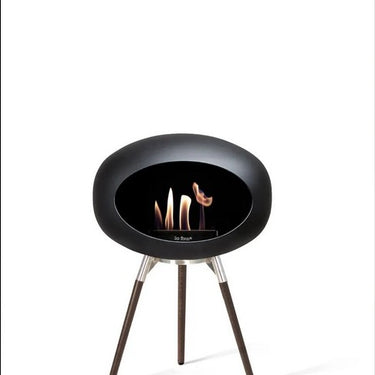 Dome Black Ground Wood Low Fireplace by Le Feu in a modern living room