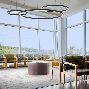 BlackJack Compass LED Hanging Light – Minimalist Round Ceiling Fixture installed in a hotel lobby