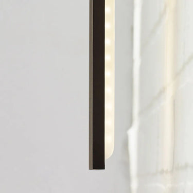 Energy-efficient Bronze Blade 24" LED wall sconce, 27.7 watts, 1951 lumens, installed near a front door for added security.
