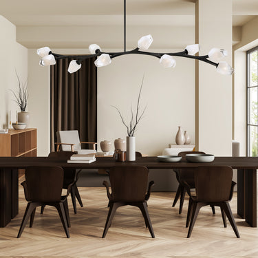 ET2 Blossom long branch pendant over a long dark dining table in a room with tall windows