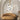 ET2 Blossom branch pendant hanging in an arched alcove above a round tan sofa