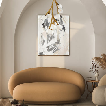 ET2 Blossom branch pendant hanging in an arched alcove above a round tan sofa