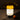 Friends Gathering Around a Table Lit by Artemide Bonta Portable Lamp