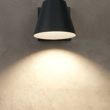 Weather-resistant LED outdoor wall sconce, IP65 rated, black finish, compact design by Visual Comfort