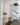 Spun metal shade of the Brummel 20-inch pendant light, reflecting a soft, ambient light - foyer lighting.
