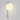 Tall Gaia wall light in satin brass with a lit matt opal glass globe, shade facing up