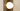 Close-up of a lit opal dome on the smoked glass plate of the Modulo wall light