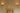 Pair of Relic wall lights with alabaster shades either side of a framed picture above a brick fireplace